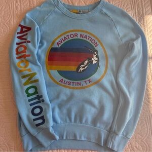 Aviator Nation Light Blue Crewneck with Rainbow Logo and Sleeve Text